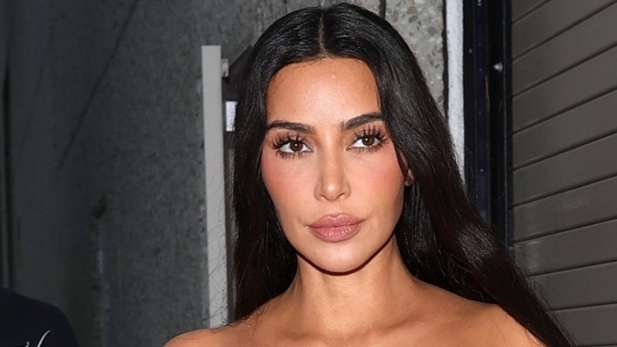 Kim Kardashian looks incredible as she flashes her abs in a tube top as she climbs inside her $100k Tesla Cybertruck --[Reported by Umva mag]