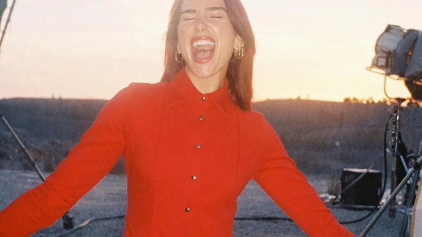 Dua Lipa ignores backlash over tour tickets as she poses in red pants and tights and says she’s ‘so happy’ --[Reported by Umva mag]