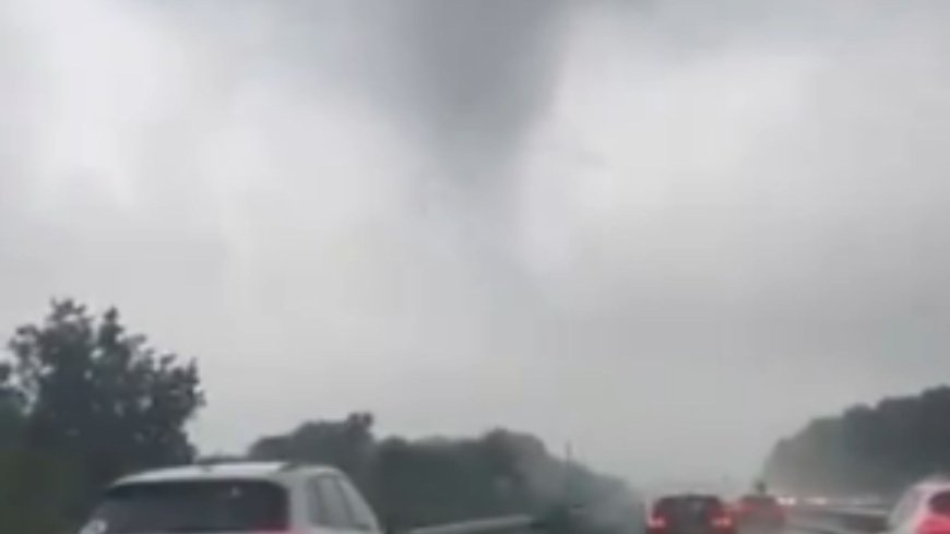 Watch as drivers barrel head-first into ‘TORNADO’ sweeping over road in Luton as storms bring month’s rain in a day --[Reported by Umva mag]