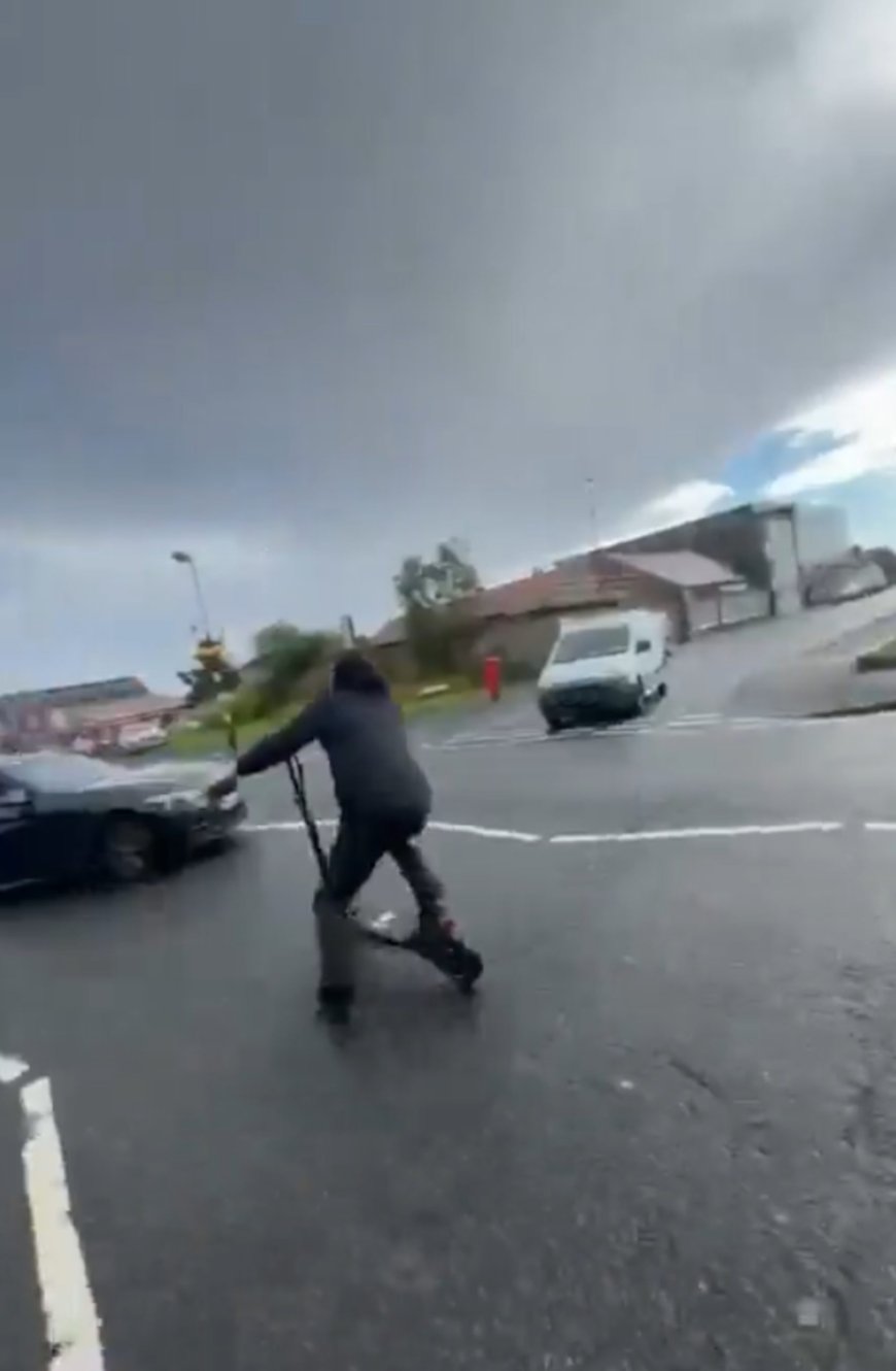 Horrifying moment young lad speeds down road on e-scooter before smashing headfirst into BMW  --[Reported by Umva mag]