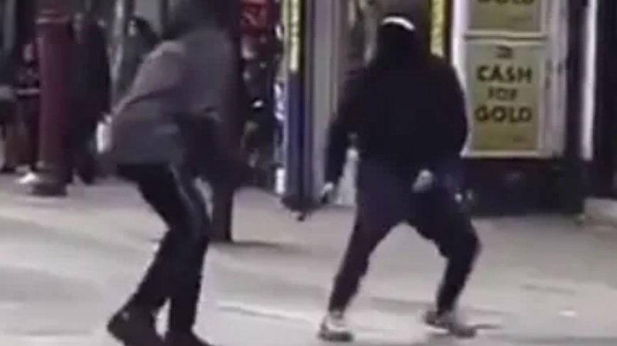 Terrifying moment machete duel breaks out in middle of packed high street as shoppers beg masked thugs to ‘stop’ --[Reported by Umva mag]